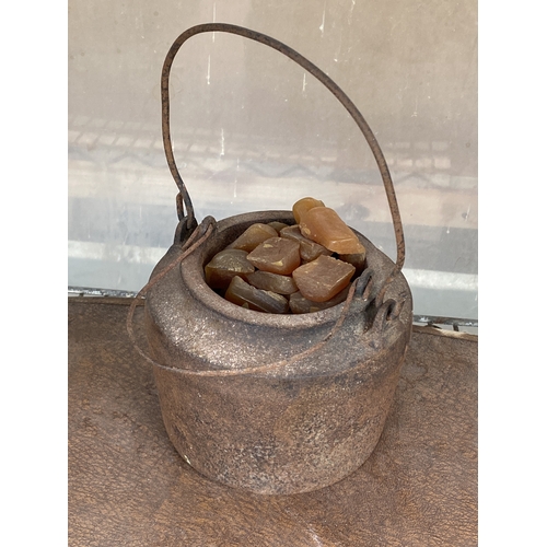 1579 - A SMALL CAST IRON COOKING POT