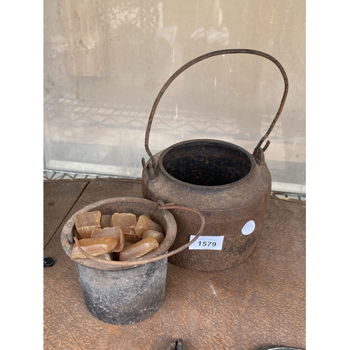 1579 - A SMALL CAST IRON COOKING POT