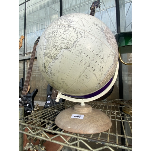 1602 - A REVOLVING WORLD GLOBE ON WOODEN BASE