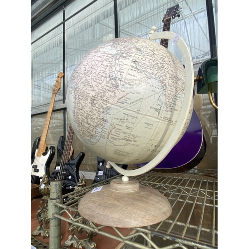 1602 - A REVOLVING WORLD GLOBE ON WOODEN BASE