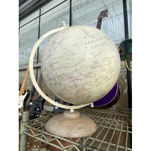 1602 - A REVOLVING WORLD GLOBE ON WOODEN BASE