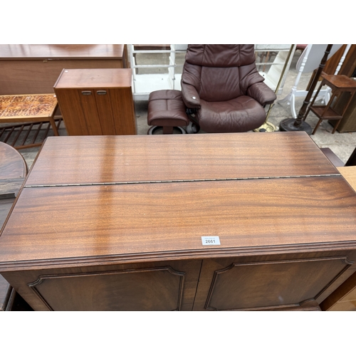 2661 - A REPRODUX MAHOGANY COCKTAIL CABINET WITH LIFT UP TOP AND TWO DRAWERS ON TAPERING LEGS, 35