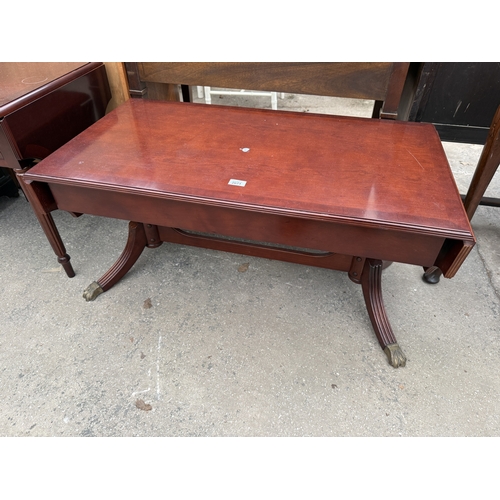 2671 - A MAHOGANY AND CROSSBANDED DROP LEAF COFFEE TABLE ON BRASS CLAW FEET