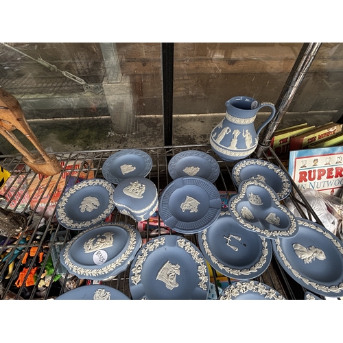 1653 - AN ASSORTMENT OF WEDGWOOD BLUE JASPER WARE ITEMS TO INCLUDE TRINKETS AND A JUG ETC