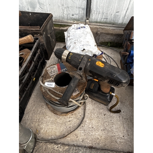 1694 - A SITEMASTER CORDLESS DRILL, A ROLL OF WIRE ROPE AND A ROLL OF ELECTRIC CABLE