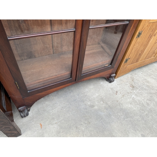2721 - A VICTORIAN MAHOGANY BOOKCASE WITH ARCHED GLAZED DOORS, 31