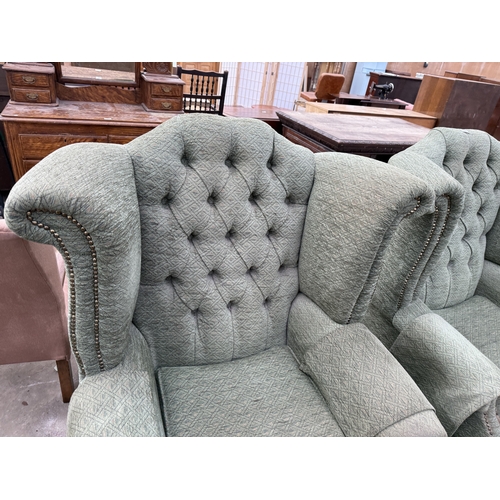 2740 - A PAIR OF WINGED FIRESIDE CHAIRS ON CABRIOLE LEGS AND LOW STOOL