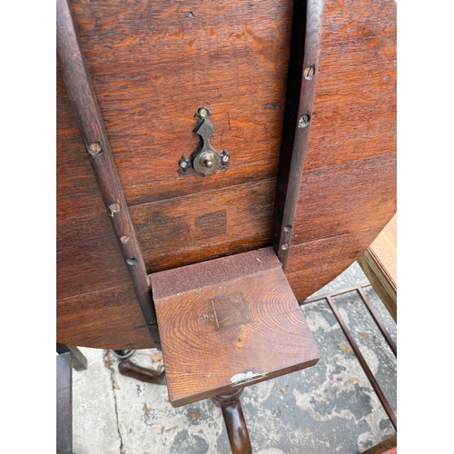 2744 - A GEORGE III STYLE OAK TRIPOD TABLE WITH TILT TOP, 29.5