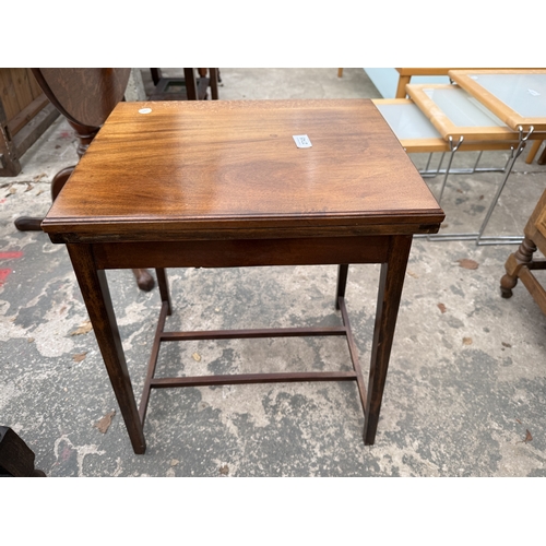 2745 - AN EDWARDIAN MAHOGANY FOLD OVER GAMES TABLE