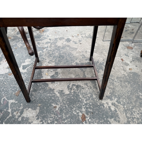 2745 - AN EDWARDIAN MAHOGANY FOLD OVER GAMES TABLE