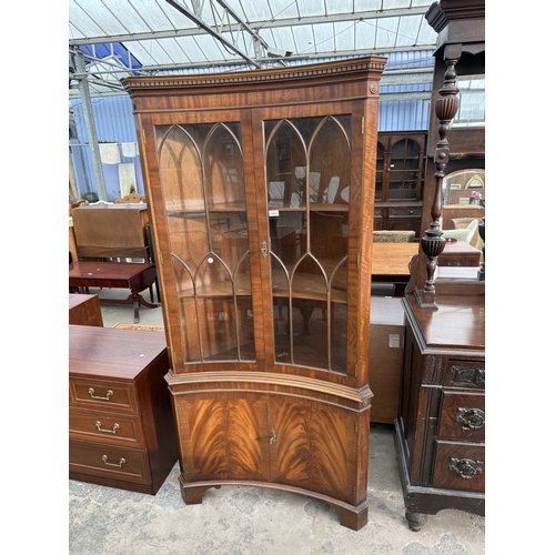 2763 - A MAHOGANY INVERTED BOW FRONTED CORNER CABINET WITH GLAZED UPPER PORTION AND DENTIL CORNICE, 36