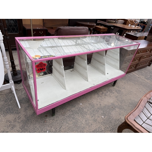 2765 - A PAINTED SHOP DISPLAY COUNTER, 71