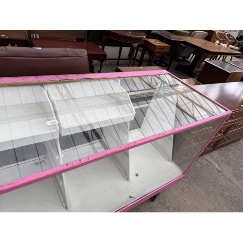 2765 - A PAINTED SHOP DISPLAY COUNTER, 71