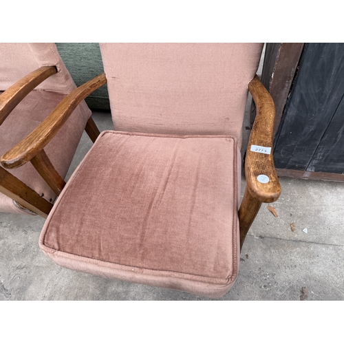 2773 - A MID 20TH CENTURY UPHOLSTERED ROCKING CHAIR AND SIMILAR FIRESIDE CHAIR