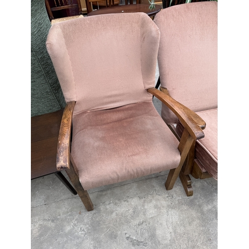 2773 - A MID 20TH CENTURY UPHOLSTERED ROCKING CHAIR AND SIMILAR FIRESIDE CHAIR