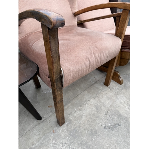 2773 - A MID 20TH CENTURY UPHOLSTERED ROCKING CHAIR AND SIMILAR FIRESIDE CHAIR