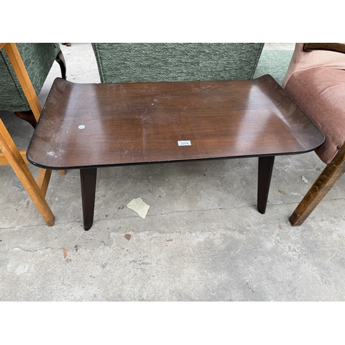 2774 - A MID CENTURY MAHOGANY SURF BOARD STYLE COFFEE TABLE