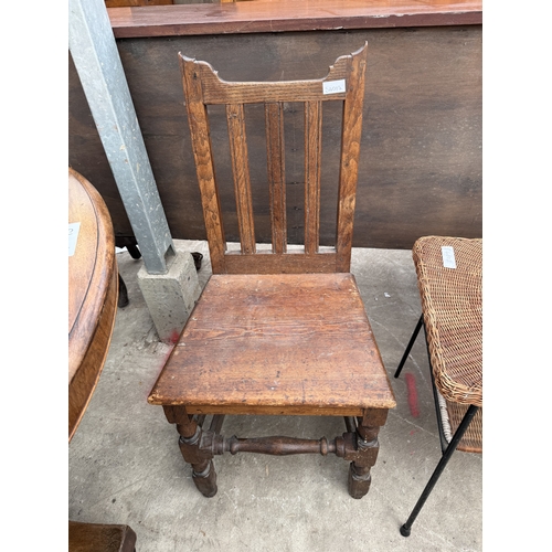 2796 - A TWO TIER WICKER COFFEE TABLE ON METALWARE FRAME AND AN OAK AND PINE COUNTRY CHAIR