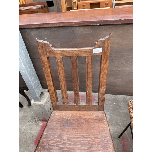 2796 - A TWO TIER WICKER COFFEE TABLE ON METALWARE FRAME AND AN OAK AND PINE COUNTRY CHAIR