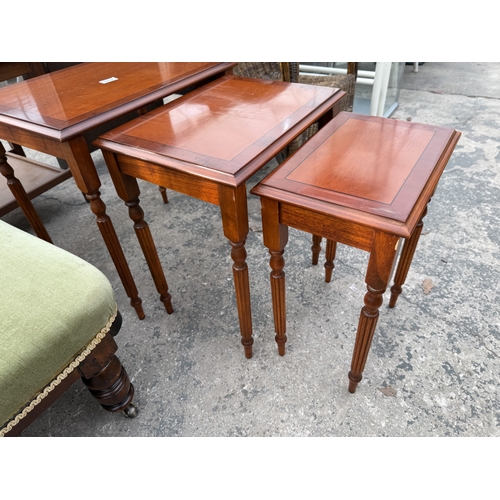 2837 - A YEW WOOD NEST OF THREE TABLES