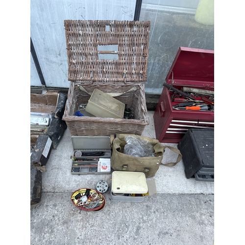 1711 - A WICKER FISHING TACKLE BASKET WITH AN ASSORTMENT OF FISHING TACKLE TO INCLUDE REELS AND FLOATS ETC