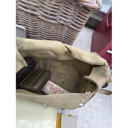 1711 - A WICKER FISHING TACKLE BASKET WITH AN ASSORTMENT OF FISHING TACKLE TO INCLUDE REELS AND FLOATS ETC