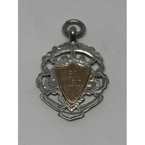 563 - A HALLMARKED BIRMINGHAM SILVER AND GOLD FOB GROSS WEIGHT 7.95 GRAMS