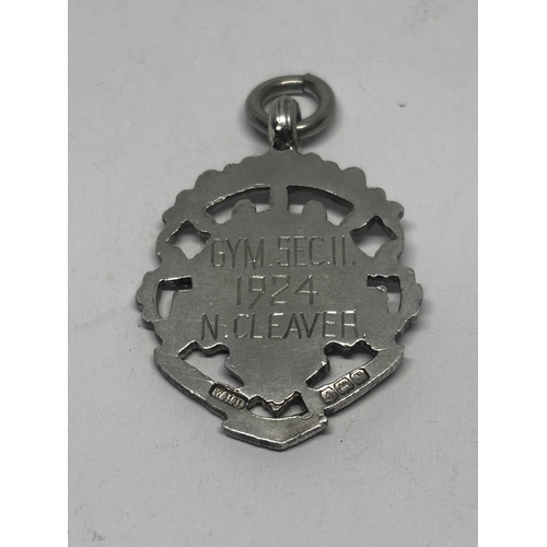 563 - A HALLMARKED BIRMINGHAM SILVER AND GOLD FOB GROSS WEIGHT 7.95 GRAMS