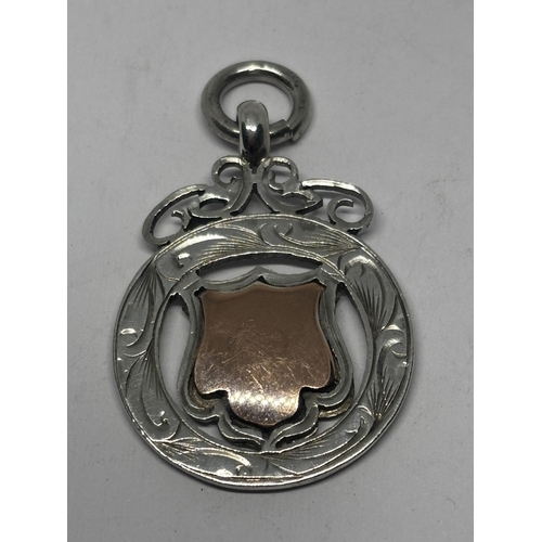 567 - A HALLMARKED BIRMINGHAM SILVER AND GOLD FOB GROSS WEIGHT 6.44 GRAMS