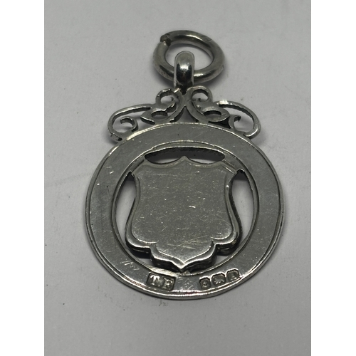 567 - A HALLMARKED BIRMINGHAM SILVER AND GOLD FOB GROSS WEIGHT 6.44 GRAMS