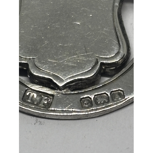 567 - A HALLMARKED BIRMINGHAM SILVER AND GOLD FOB GROSS WEIGHT 6.44 GRAMS