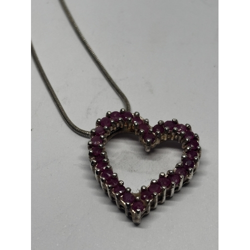 585 - TWO SILVER NECKLACES WITH PENDANTS GROSS WEIGHT 14.02 GRAMS