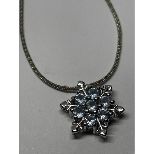 585 - TWO SILVER NECKLACES WITH PENDANTS GROSS WEIGHT 14.02 GRAMS