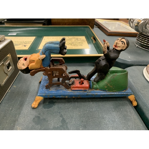 81 - A CAST MECHANICAL COIN BANK 