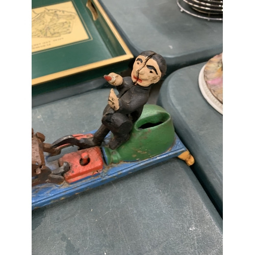 81 - A CAST MECHANICAL COIN BANK 