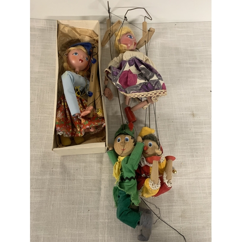 317 - FOUR VINTAGE PELHAM PUPPETS ONE BOXED TO INCLUDE DUTCH GIRL, ROBIN HOOD ETC