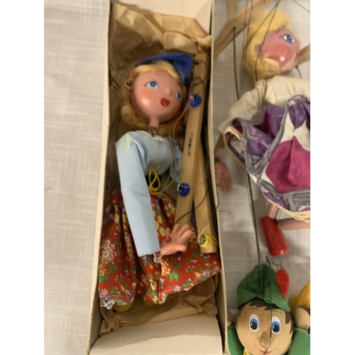 317 - FOUR VINTAGE PELHAM PUPPETS ONE BOXED TO INCLUDE DUTCH GIRL, ROBIN HOOD ETC