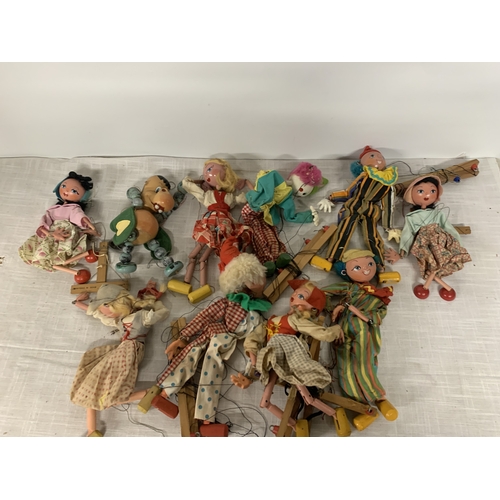 327 - A LARGE QUANTITY OF PELHAM PUPPETS TO INLCUDE A CLOWNS, BABY DRAGON ETC