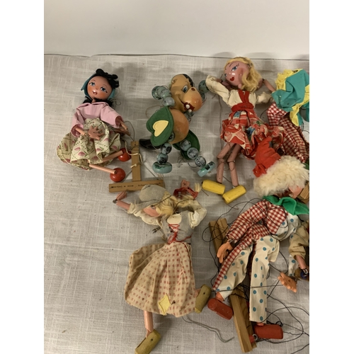 327 - A LARGE QUANTITY OF PELHAM PUPPETS TO INLCUDE A CLOWNS, BABY DRAGON ETC