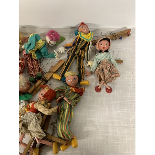 327 - A LARGE QUANTITY OF PELHAM PUPPETS TO INLCUDE A CLOWNS, BABY DRAGON ETC