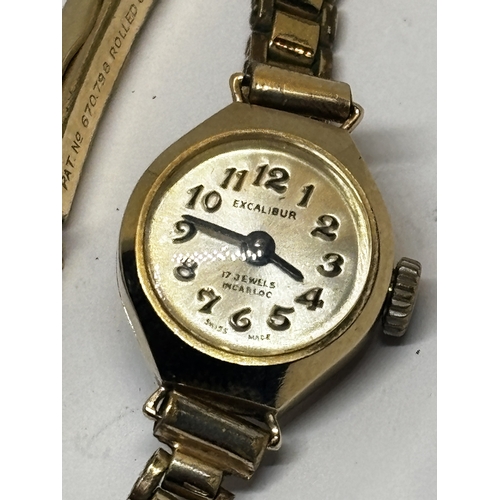 761 - A 9 CARAT GOLD EXCALIBUR COCKTAIL WATCH WITH A PLATED STRAP GROSS WEIGHT 12.92 GRAMS