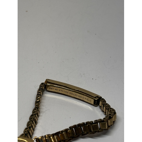 761 - A 9 CARAT GOLD EXCALIBUR COCKTAIL WATCH WITH A PLATED STRAP GROSS WEIGHT 12.92 GRAMS