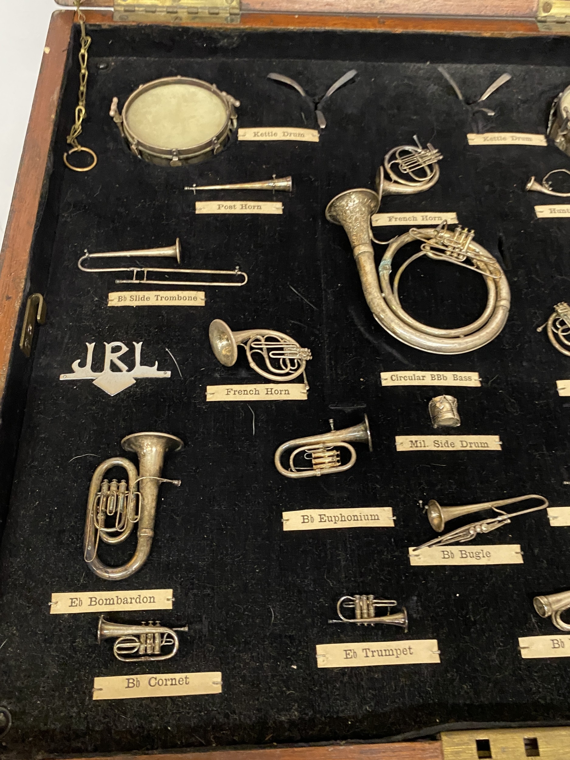 A VINTAGE SET OF MINIATURE BRASS, SILVER PLATED MUSICAL INSTRUMENTS ...