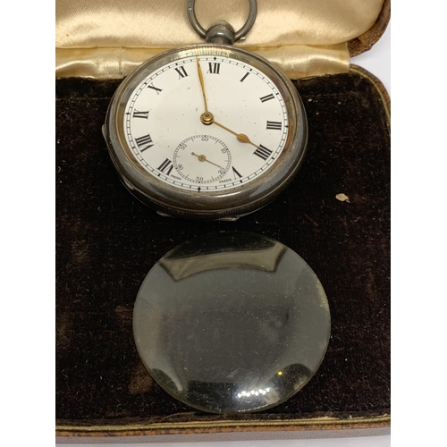 781 - A HALLMARKED BIRMINGHAM SILVER POCKET WATCH WITH WHITE ENAMEL FACE, SUB DIAL AND ROMAN NUMERALS