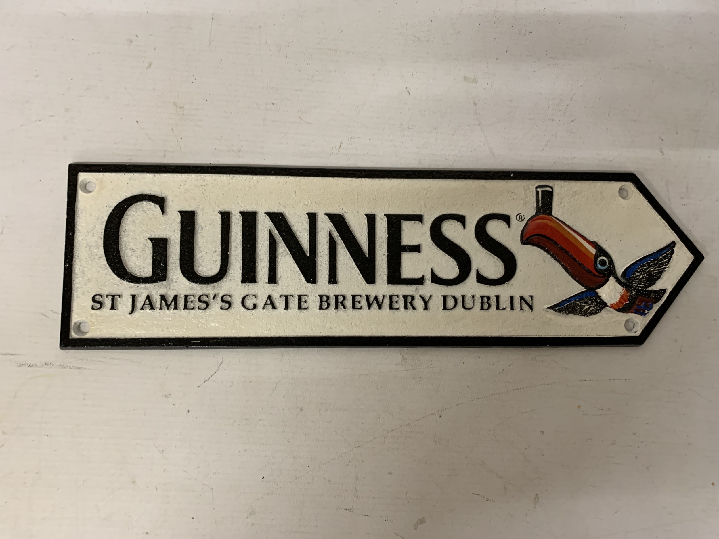 A CAST GUINNESS SIGN