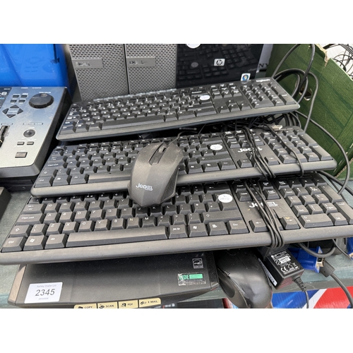 AN ASSORTMENT OF COMPUTER TOWERS, KEYBOARDS AND A CANON SCANNER ETC