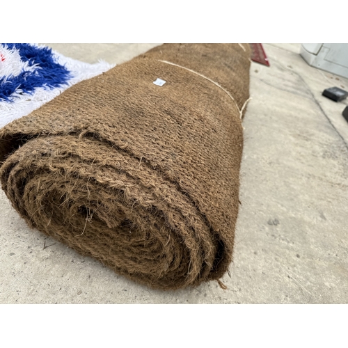 A LARGE HESSIAN RUG
