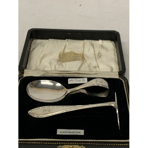 13 - A HALLMARKED BIRMINGHAM SILVER CHRISTENING SET WITH CHILDS SPOON AND PUSHER BOXED, WEIGHT 40 GRAMS.