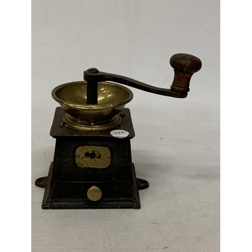 22 - A VINTAGE STEEL AND BRASS COFFEE GRINDER WITH INDISTINCT NAME PLAQUE
