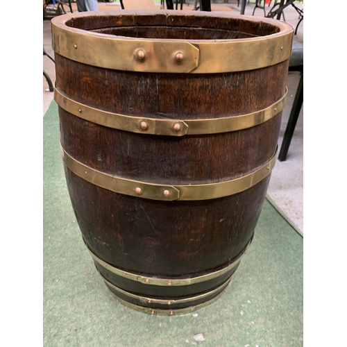 36 - A VINTAGE OAK BRASS COOPERED BARREL STICK STAND, HEIGHT 61CM